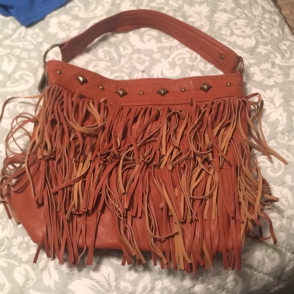 Brown fringe purse by Carlos Santana. - Picture 1 of 4